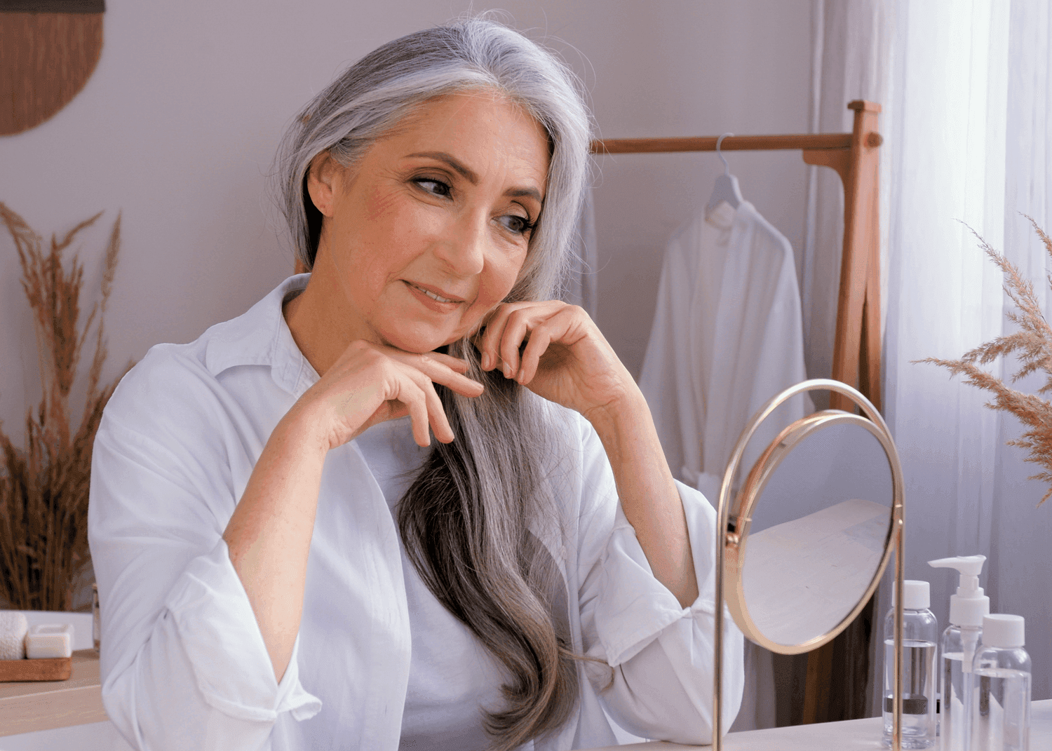 Mature Woman looking Into Mirror