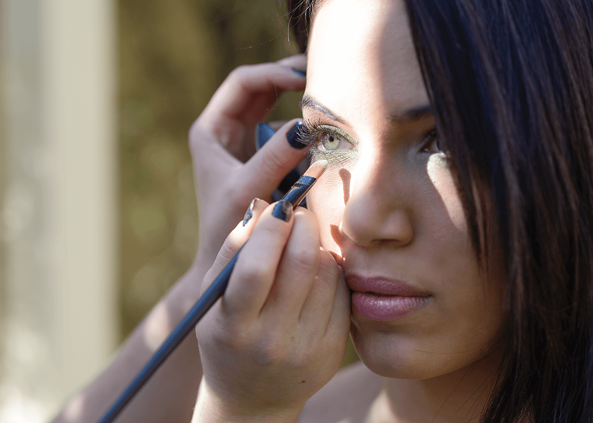 A woman troubleshooting smudging of her eyeliner