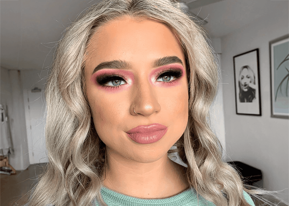 Blue eyes pop with pink eyeshadow shimmer