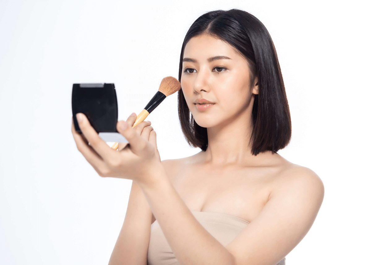 Asian Model Applying Setting Powder to Face