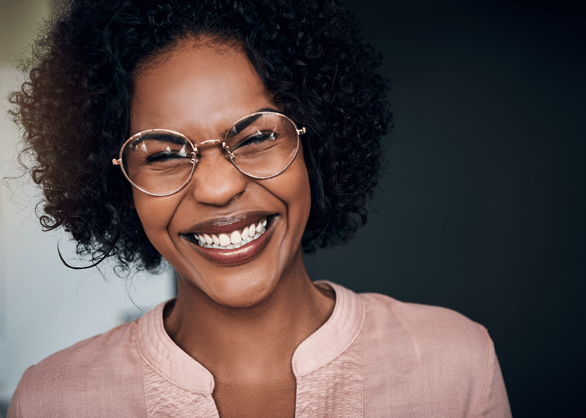 Laughing Lady with Makeup Wearing Glasses