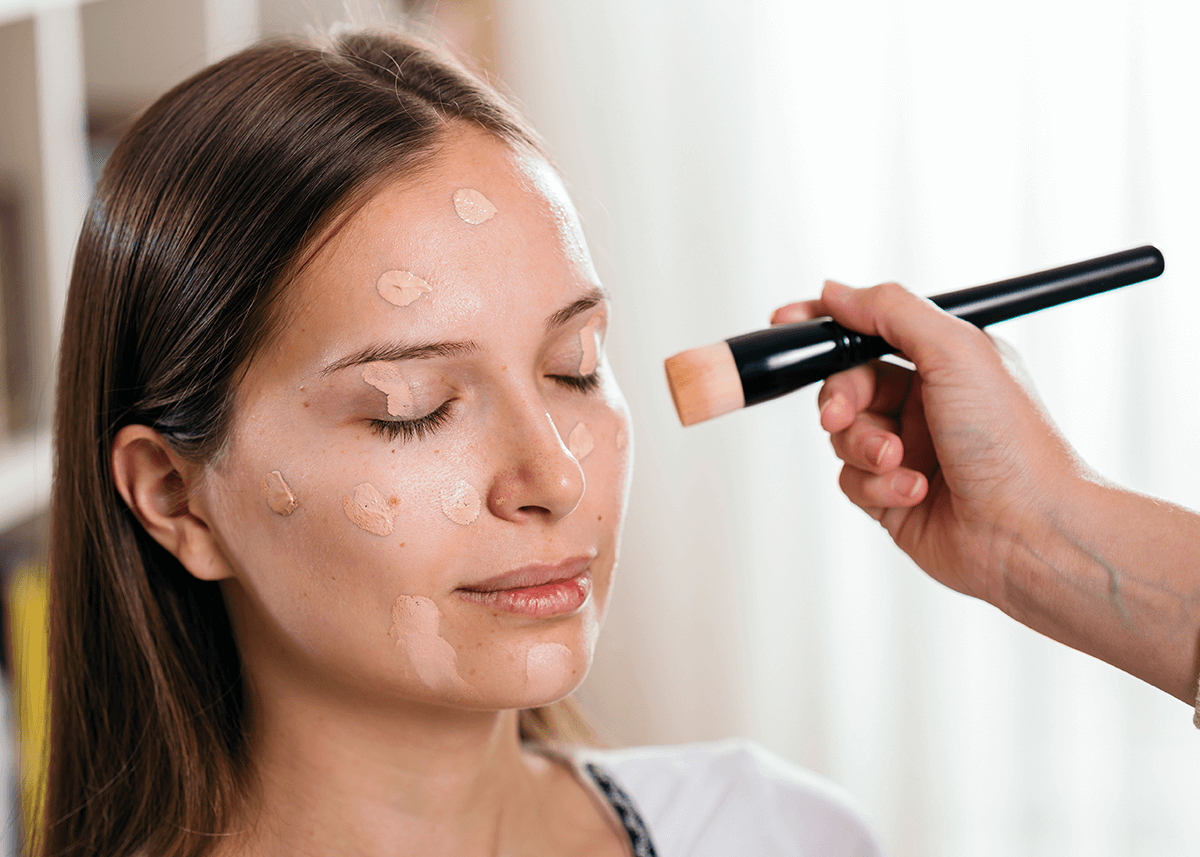 Makeup Artist Applying Liquid Face Powder