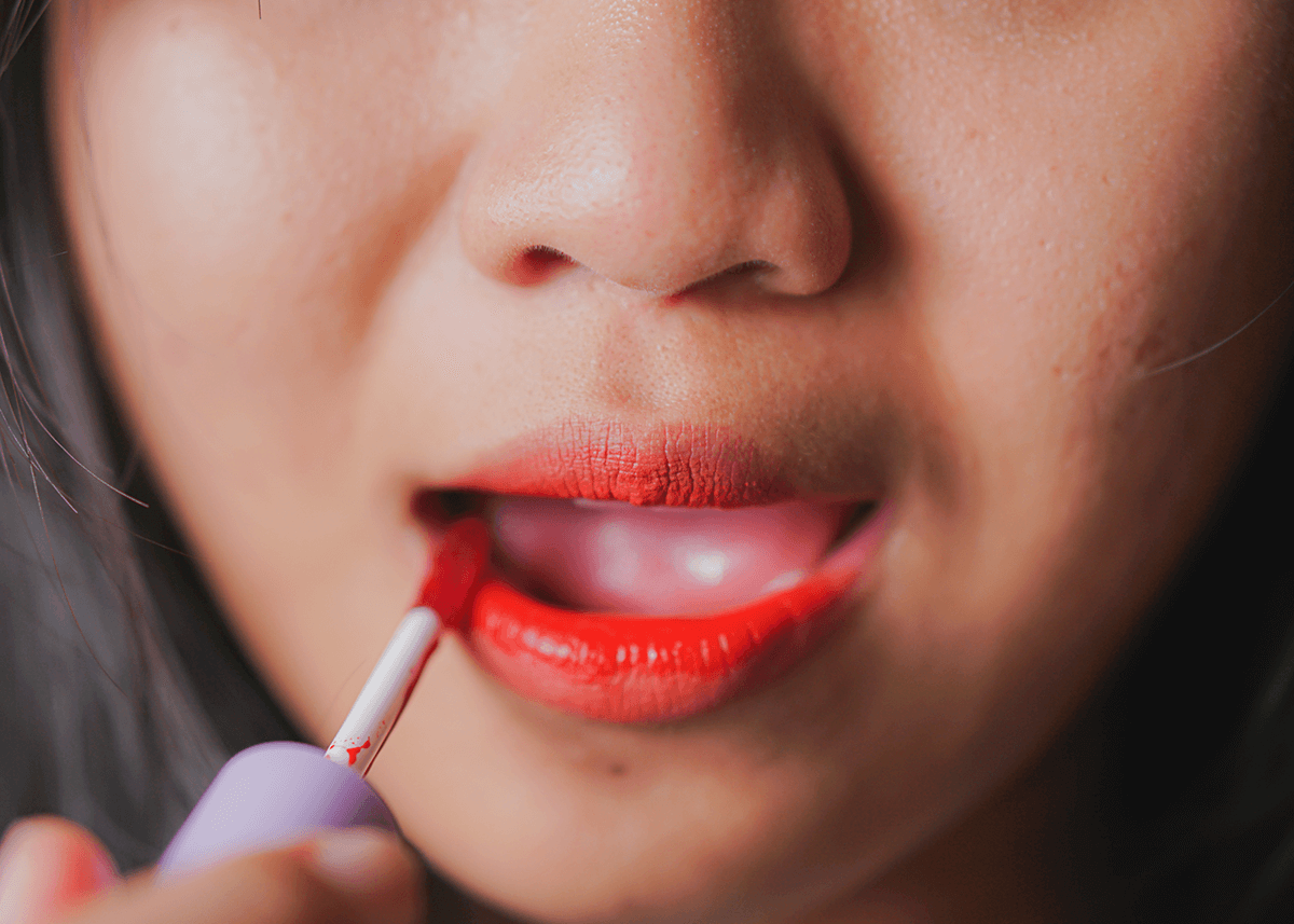 Woman Painting Lips with Lip Colour