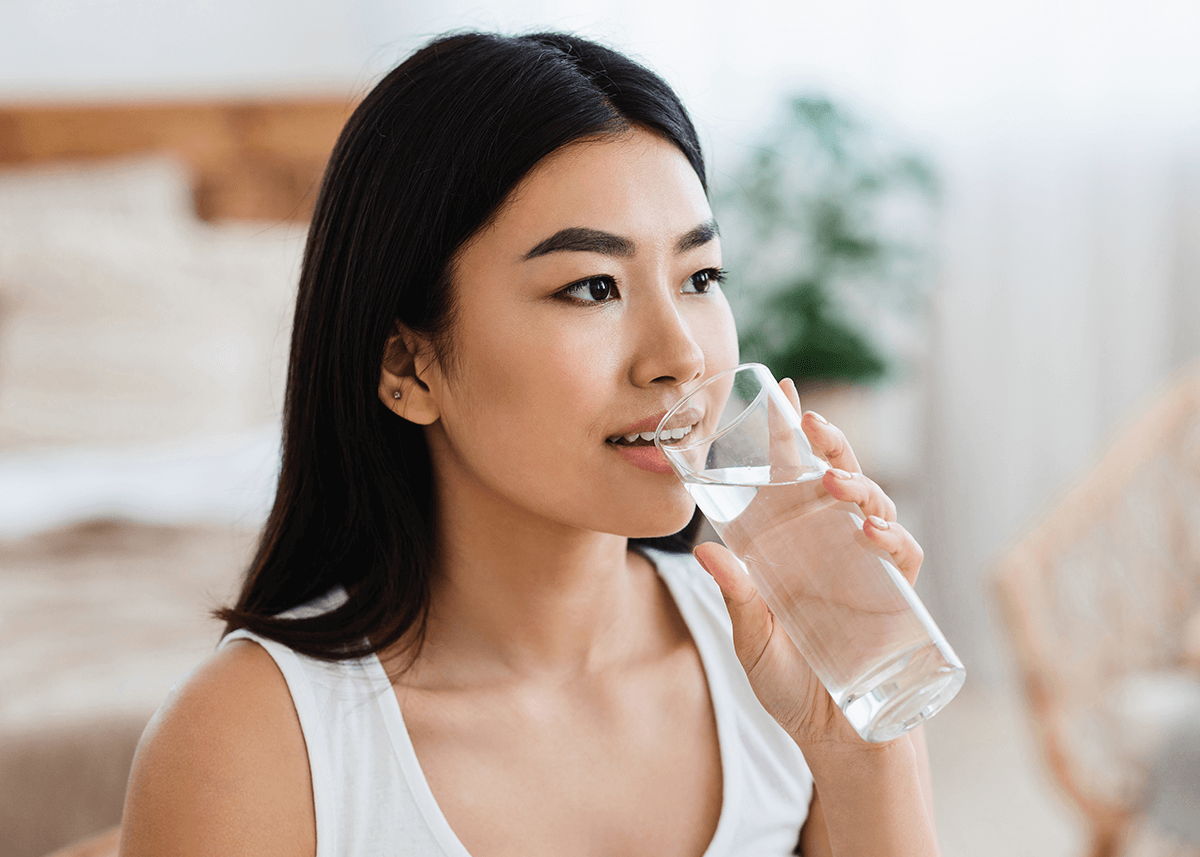 Young Asian Girl Drinking Water