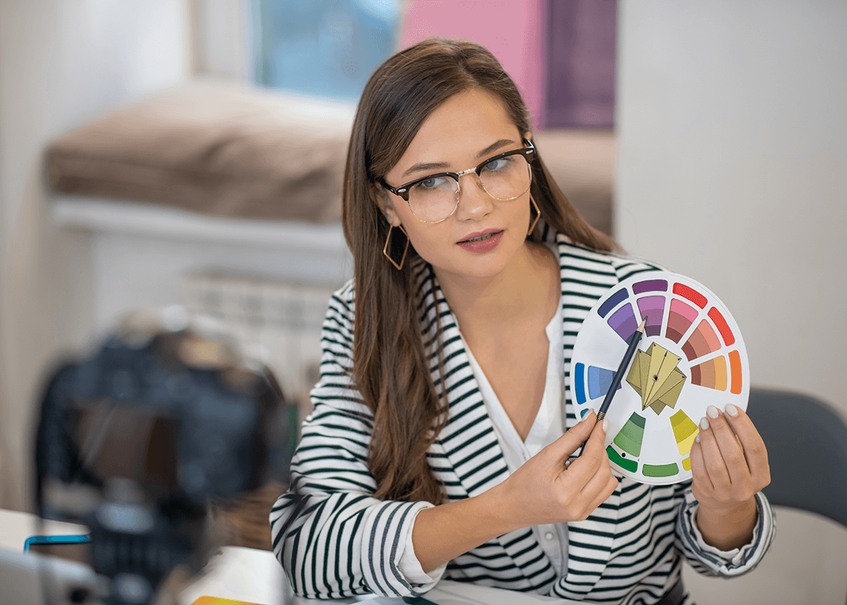 Young Woman Pointing to Colour Wheel