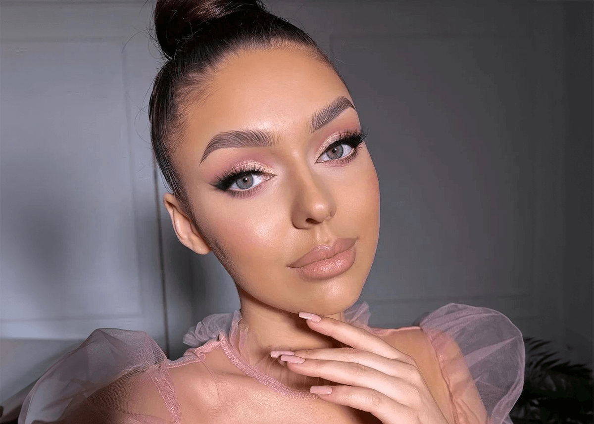 Pink eyeshadow posed with pink ruffle dress