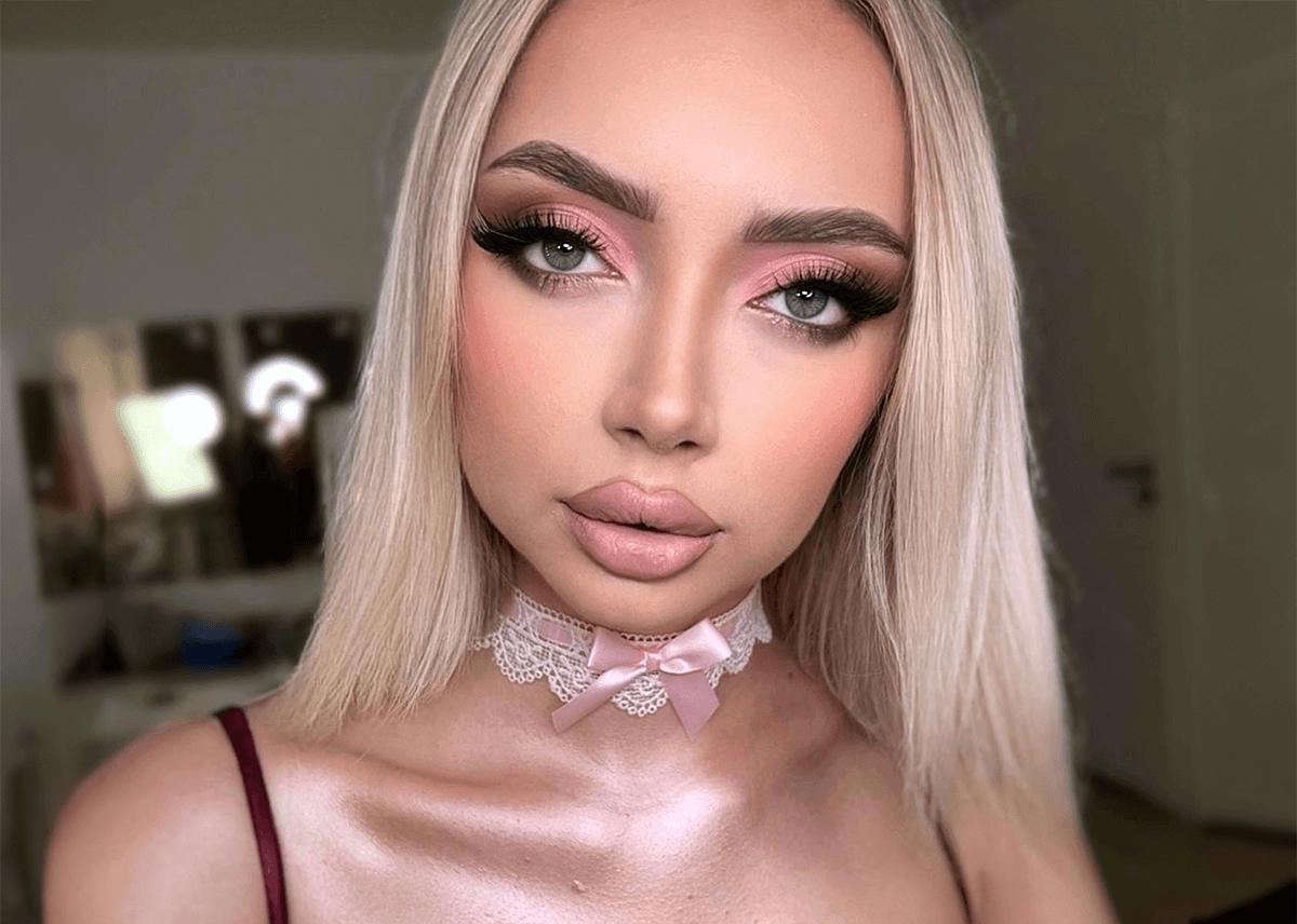 Baby doll makeup with liquid pink highlighter